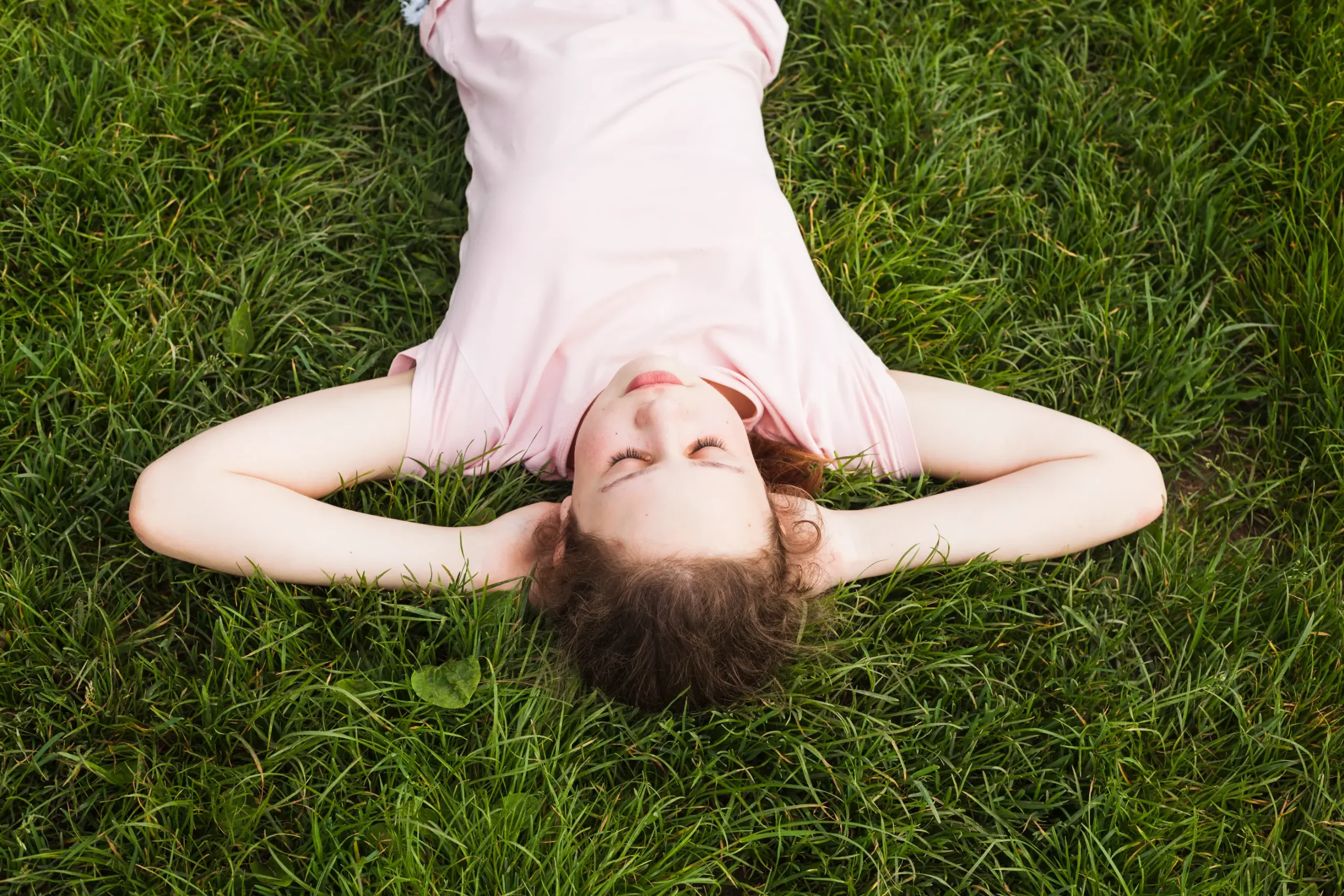 child practicing coping techniques through calm breathing in the park