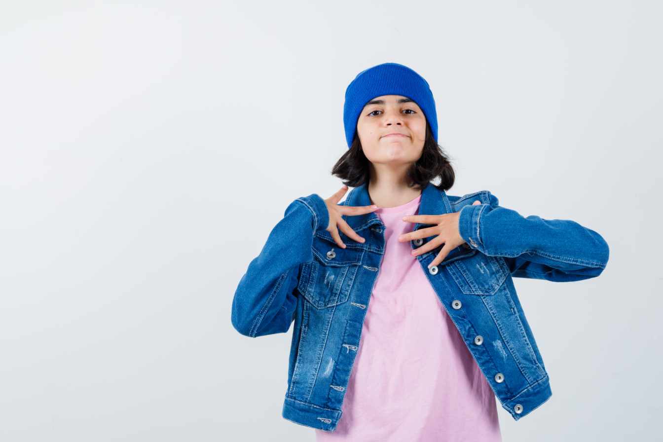 A teenager with a blue hat